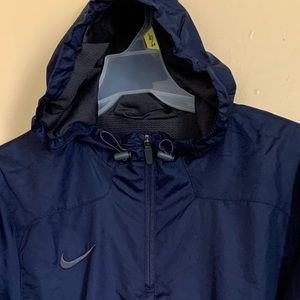 Nike wind stopper running 1/4 zipped running hoodie with Velcro hand closing.